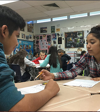 Students help each other in class